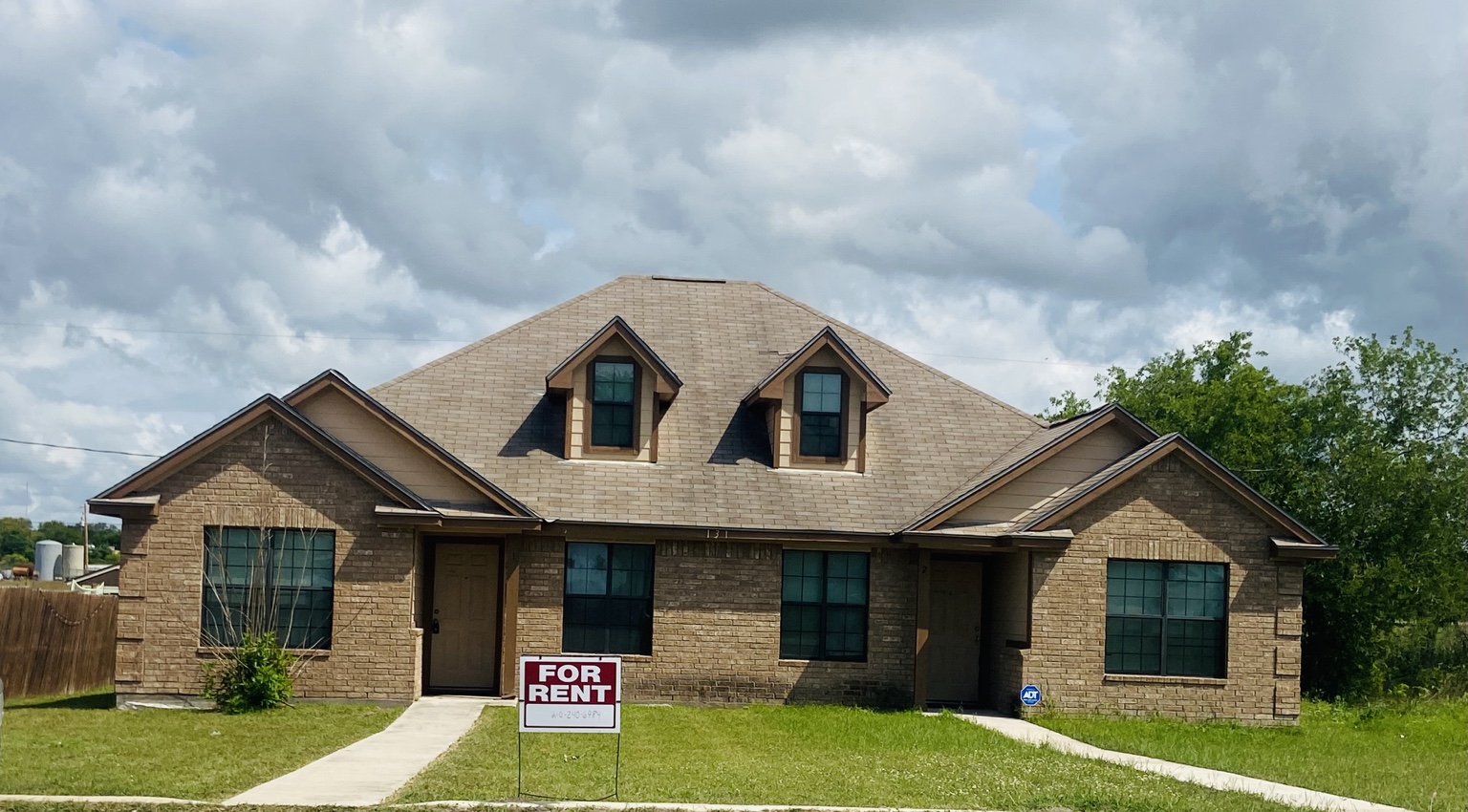 Front exterior of the duplex at 131 Robinhood Drive
